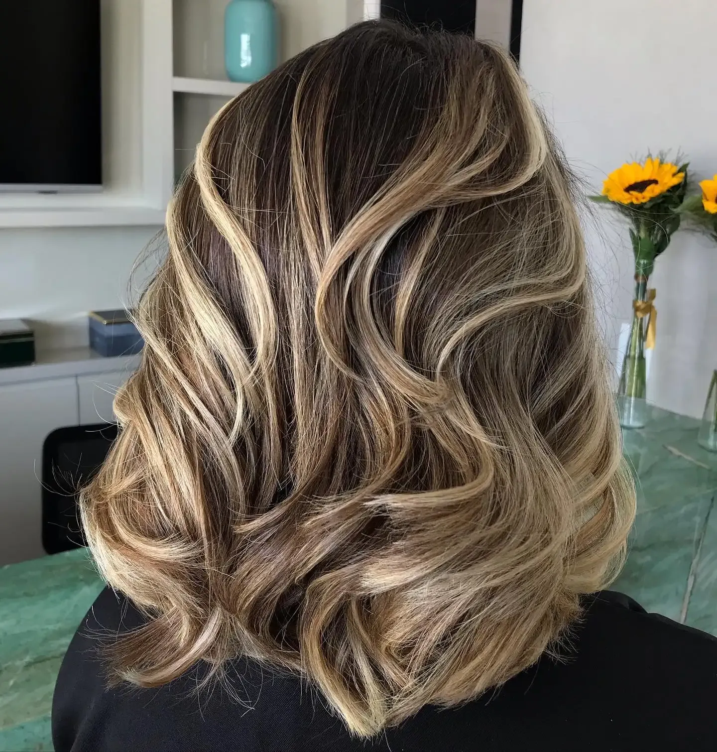 Stunning brown hair with blonde highlights butterfly cut