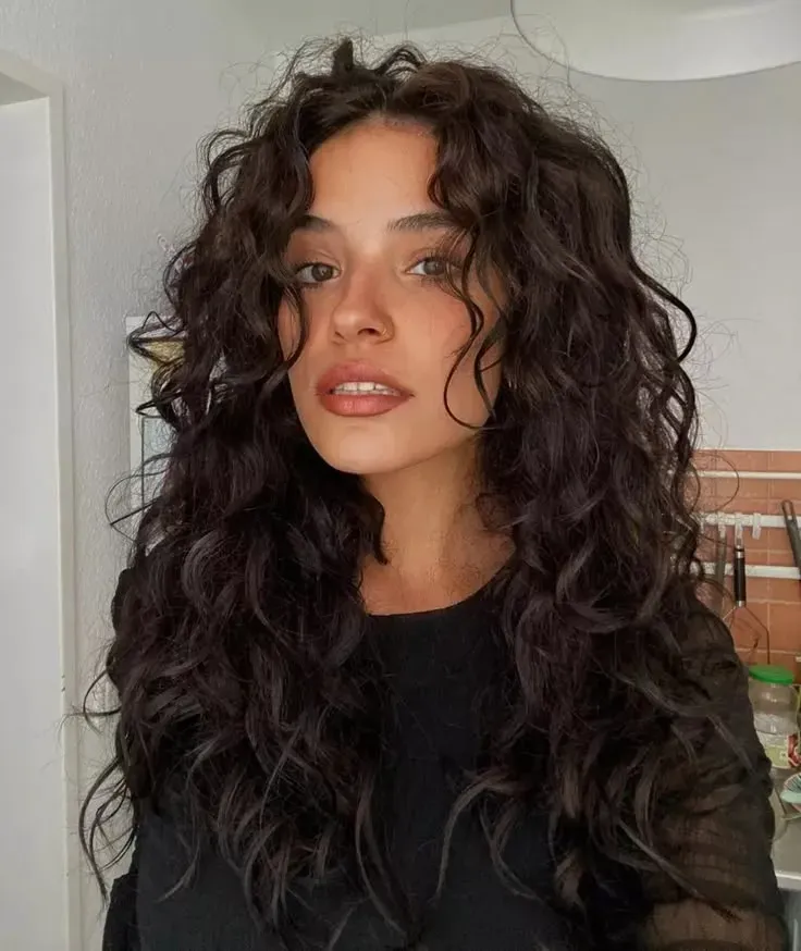 How to master the perfect butterfly cut long curly hair